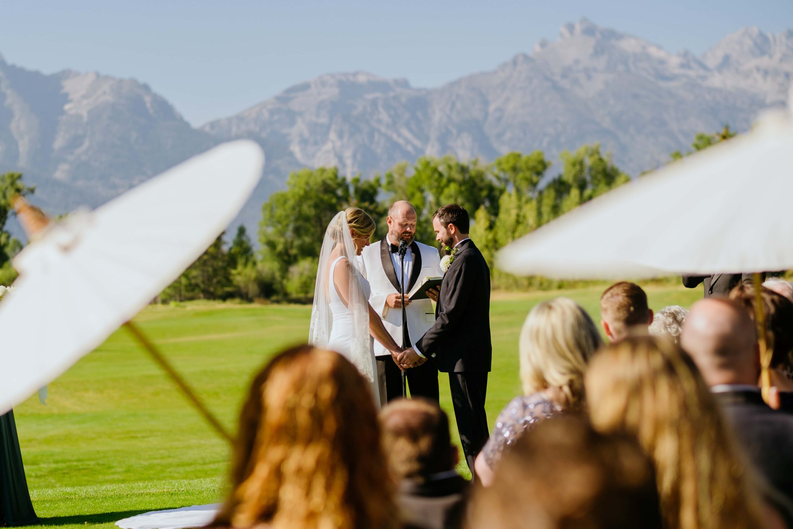 wedding at jackson hole golf and tennis club. grand teton mountians and bride and groom.