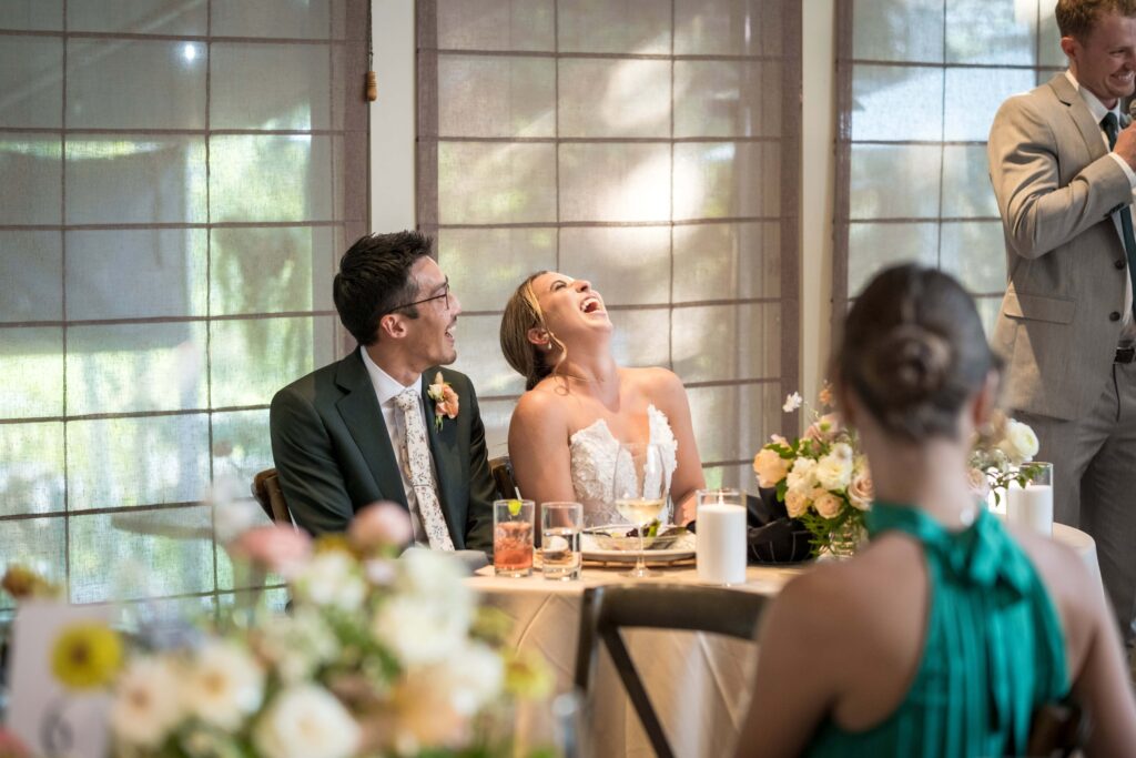 bride laughs at wedding speech