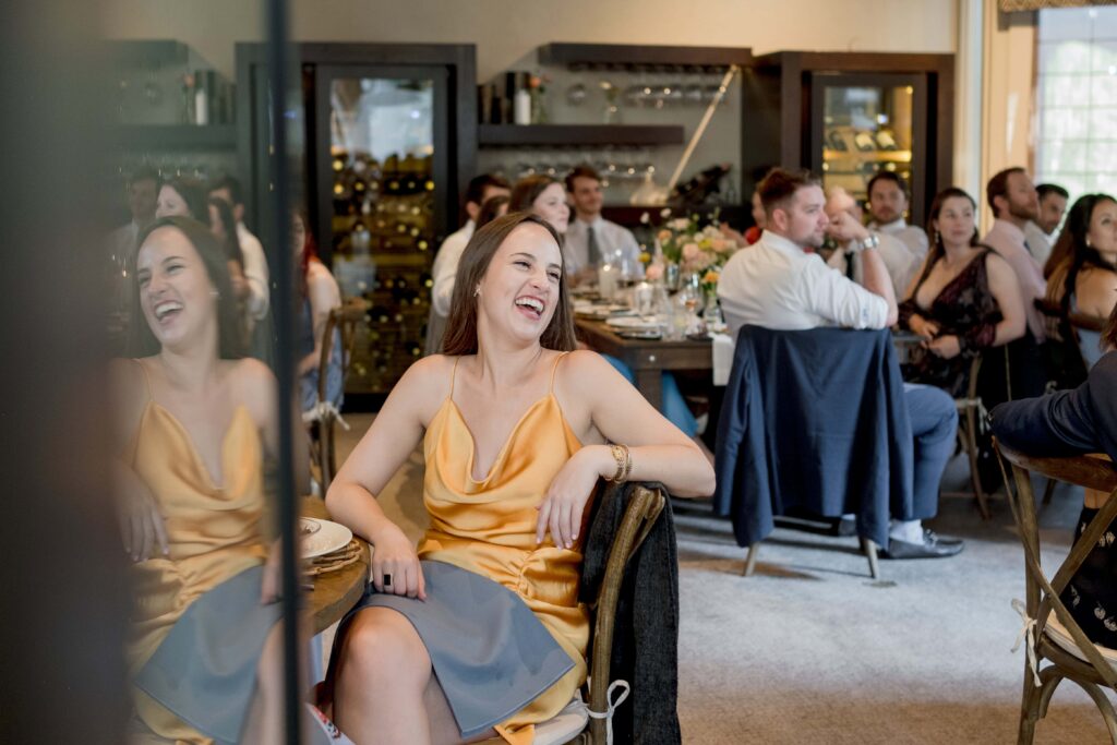 guest laughs at wedding speech