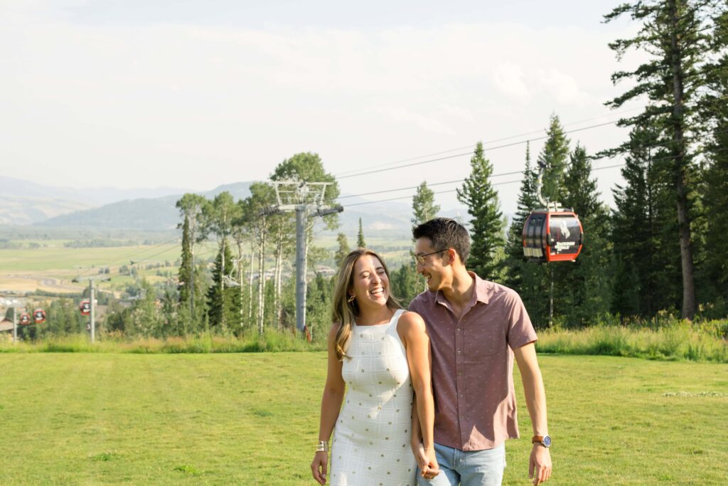 bride and groom laughing with gondola at jackson hole resort