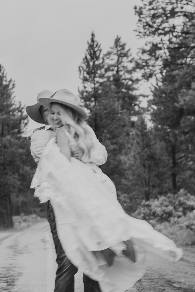 bride and groom running on road grand teton wedding portraits