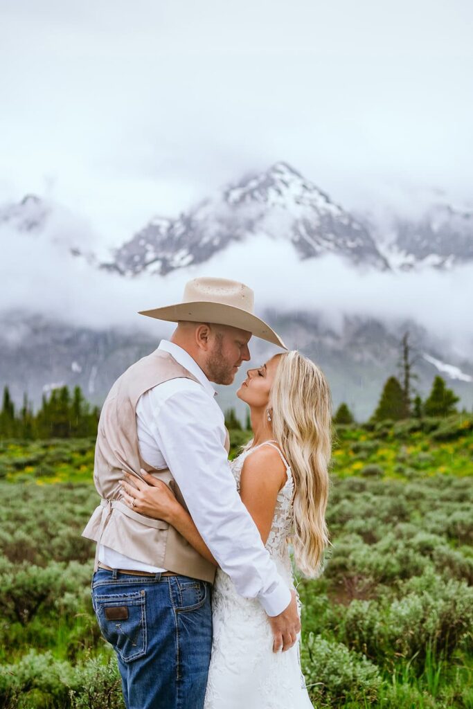 bride and groom kissing  grand teton wedding portraits