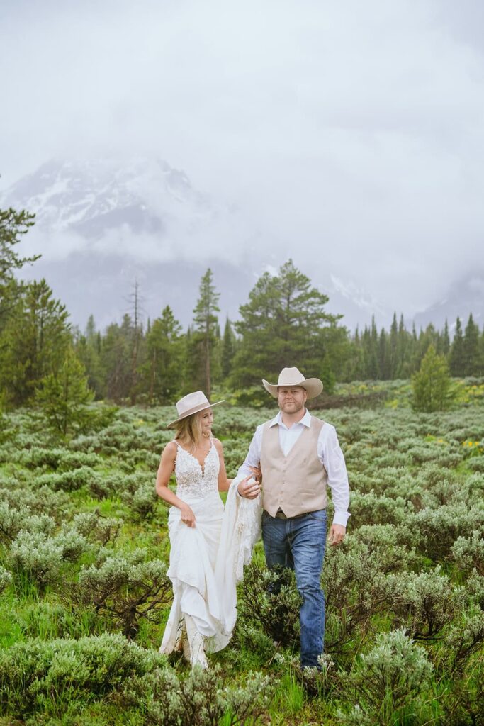 bride and groom walking  grand teton wedding portraits