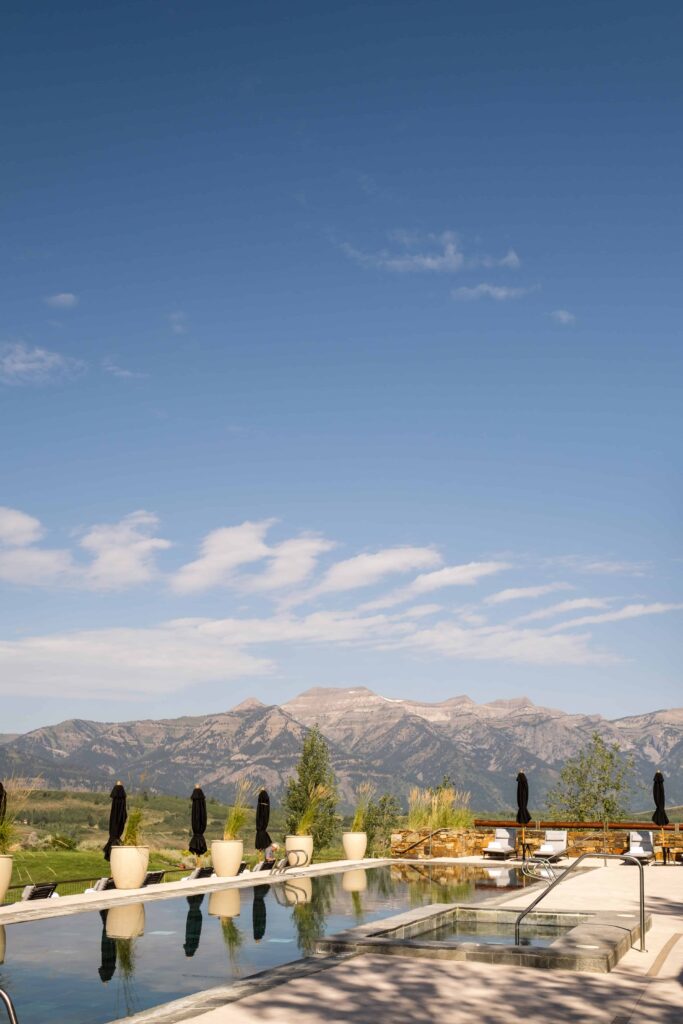 amangani in jackson hole pool view with mountain range
