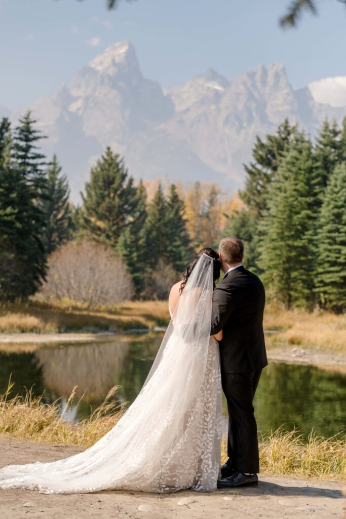 bride and groom getting married at swabacher's landing, Grand Teton National Park