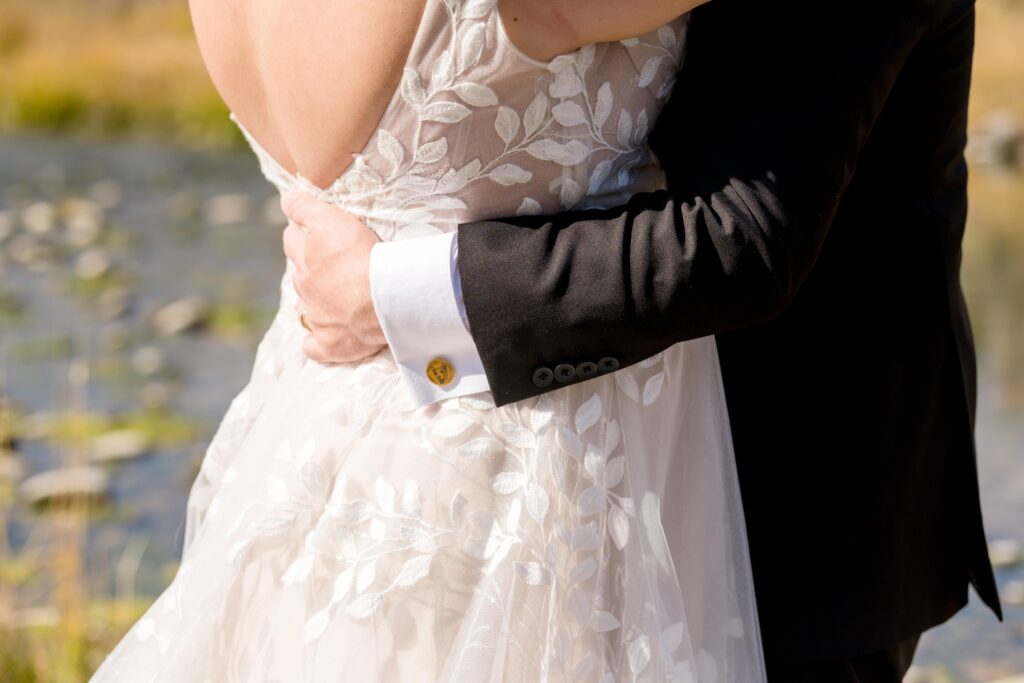 groom hugging bride