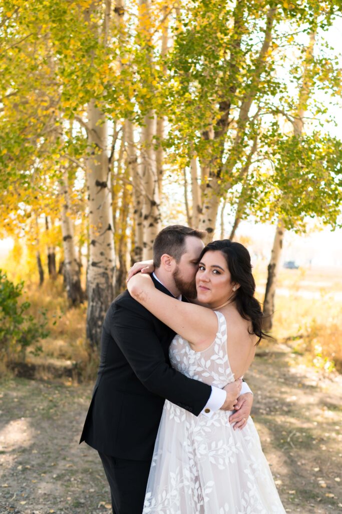 bride and groom hugging