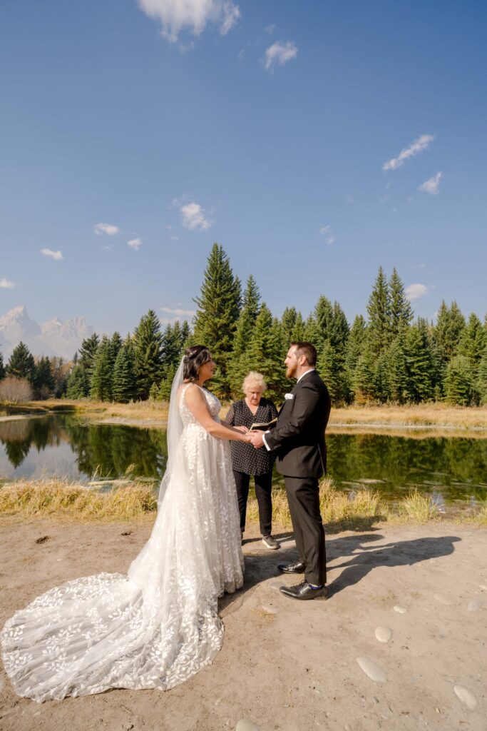 bride and groom getting married at swabacher's landing, Grand Teton National Park