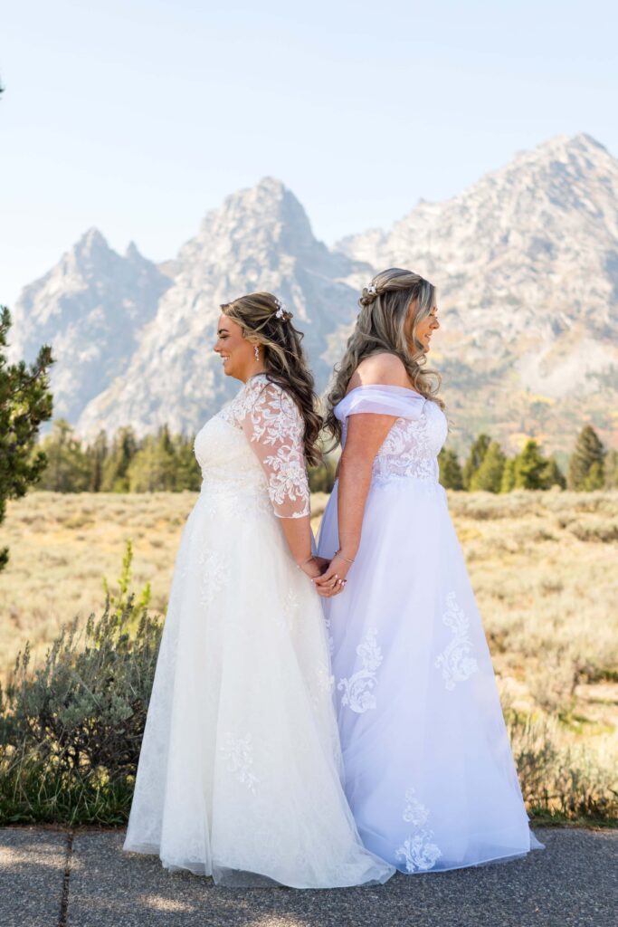 two brides holding hands in grand teton national park