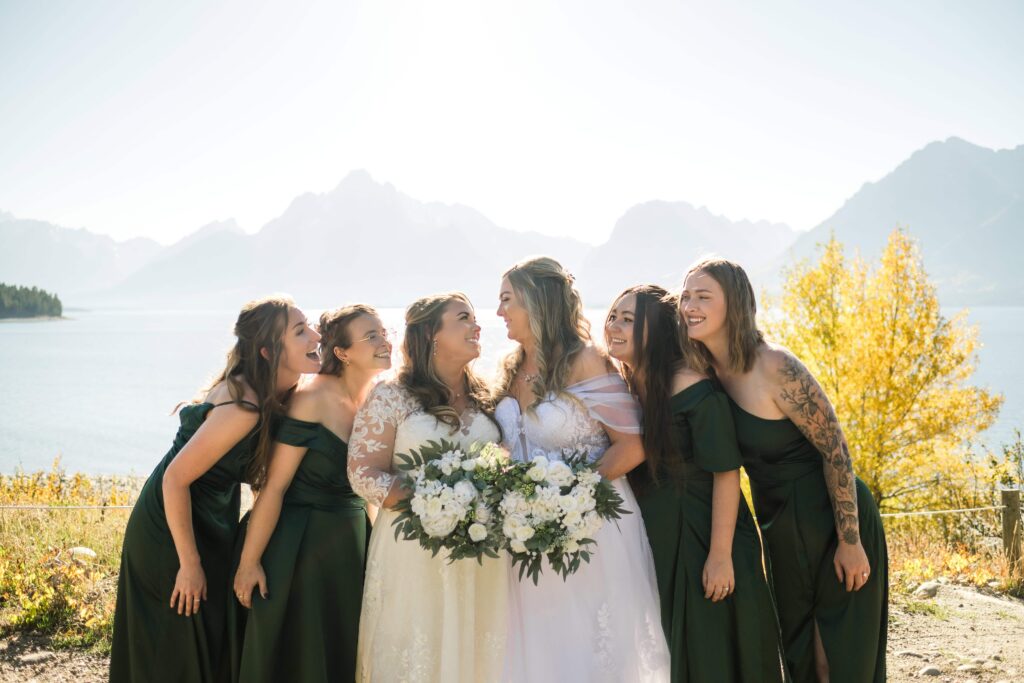 two brides and their bridesmaids in grand tetons