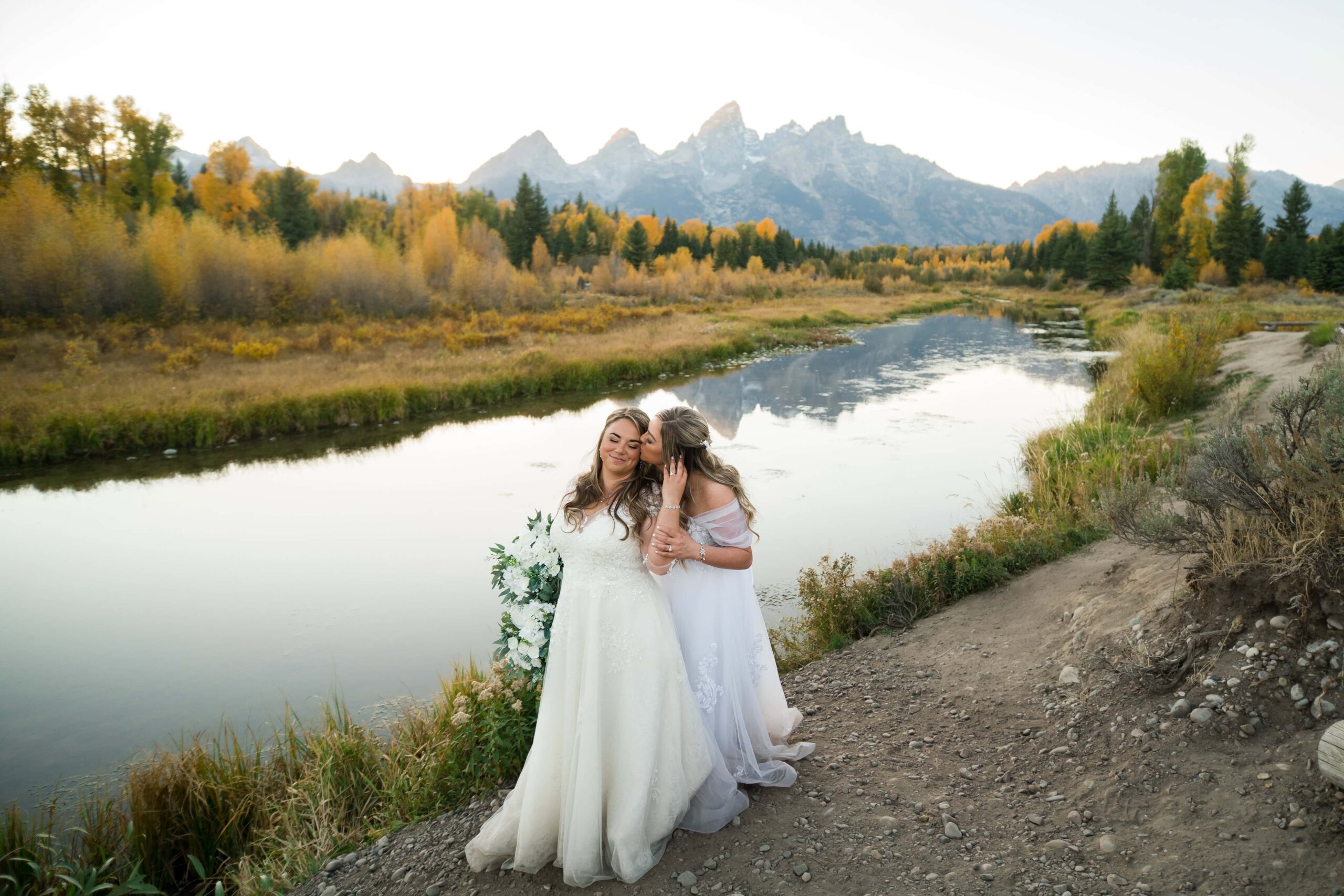 two brides with tetons in background