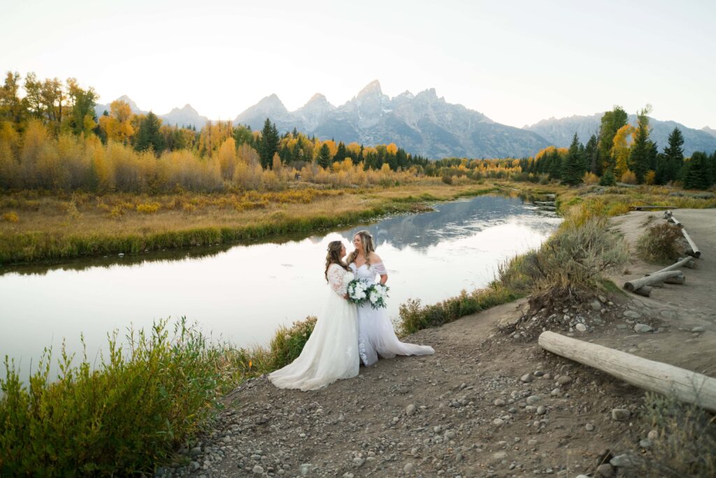 two brides with tetons in background