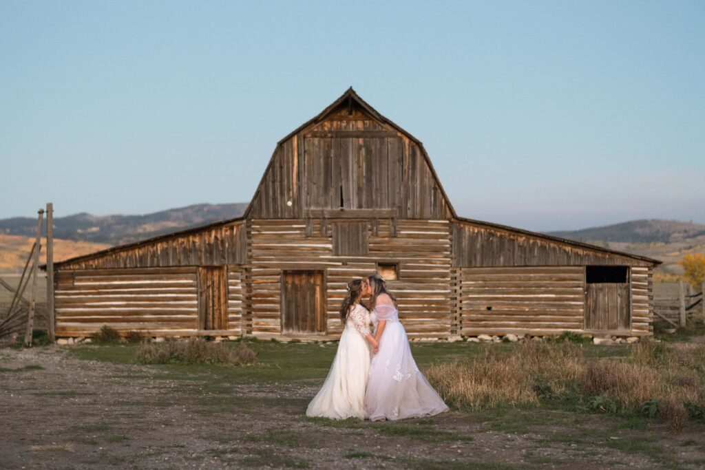 two brides with mormon row barn in grand teton national park