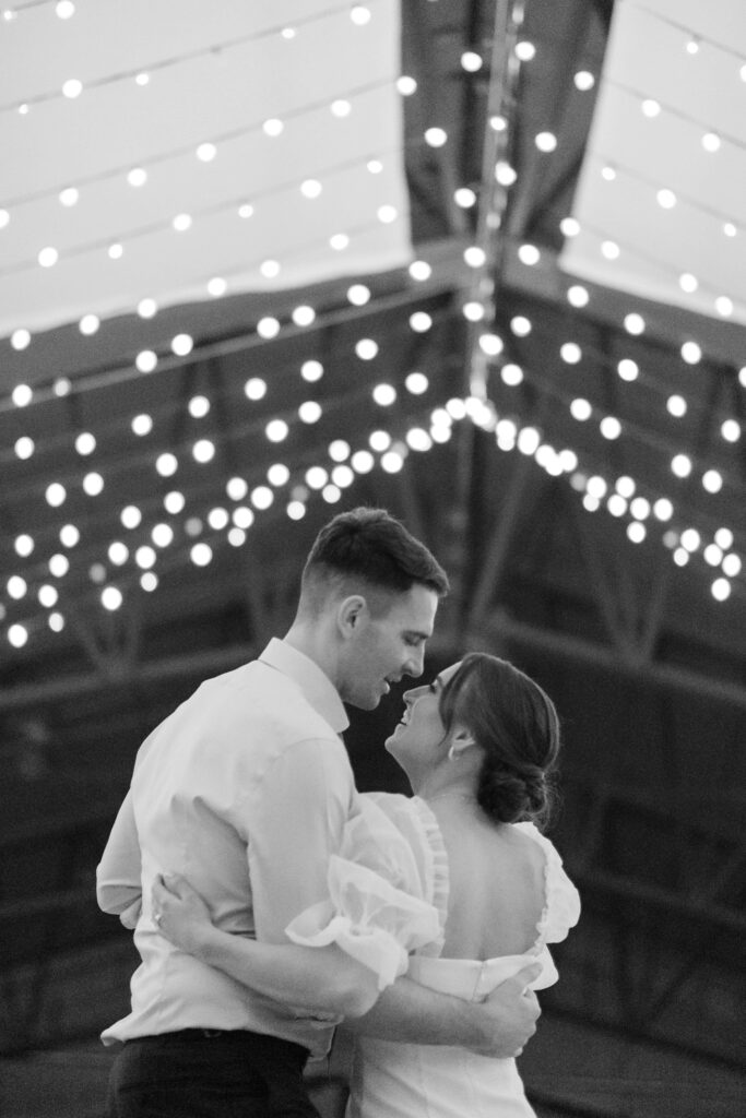 couple dancing on their wedding day inside diamond cross ranch wedding barn