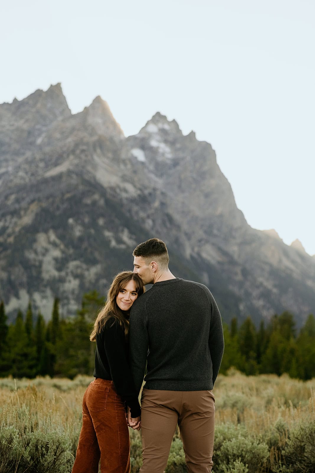 Couple poses at cascade canyon in grand teton national park