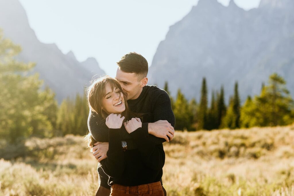 couple hug in grand teton national park 