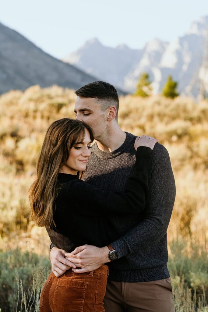 Couple kissing for their jackson hole engagement photos