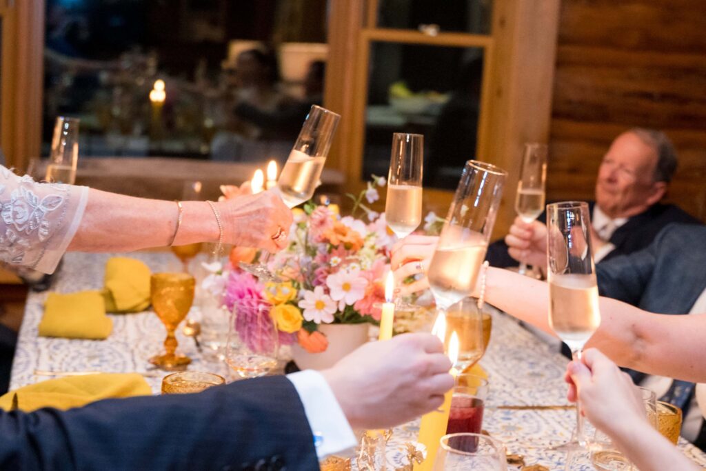 A group cheers champagne after celebrating jackson hole elopement 